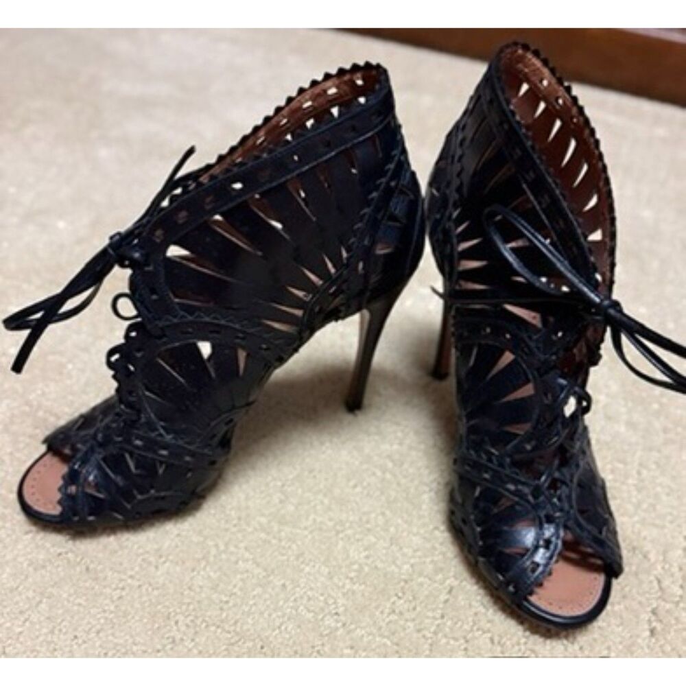 ALAÏA Black Leather Laser-Cut Out Vienne Motif Sandal Heels